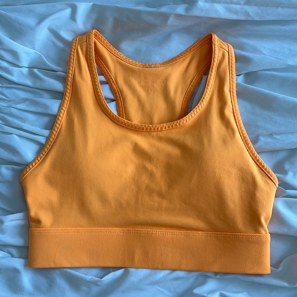 Fluorescent orange fabletics sports bra